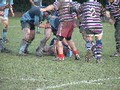 The skipper demonstrates correct posture for entering the ruck